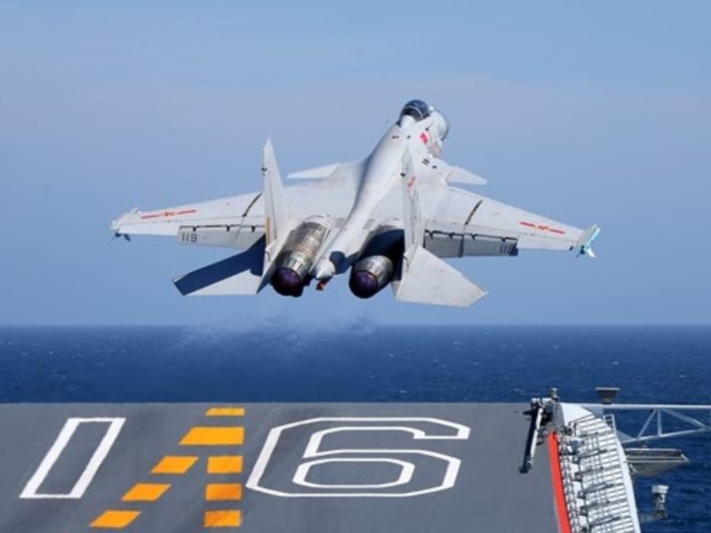 A J-15 carrier-borne fighter jet takes off from the flight deck of the aircraft carrier Liaoning during a maritime training exercise. Picture: ChinaMil/PLA