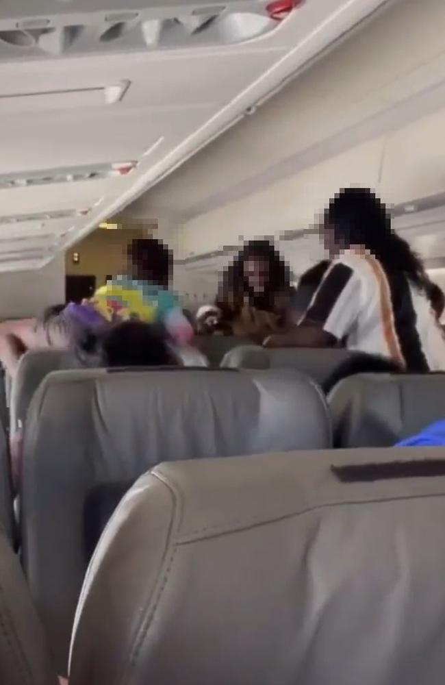 Australian Federal Police and NT Police arrested four passengers over an alleged brawl on a flight from Cairns to Darwin, via Groote Eylandt, on Thursday April 20.