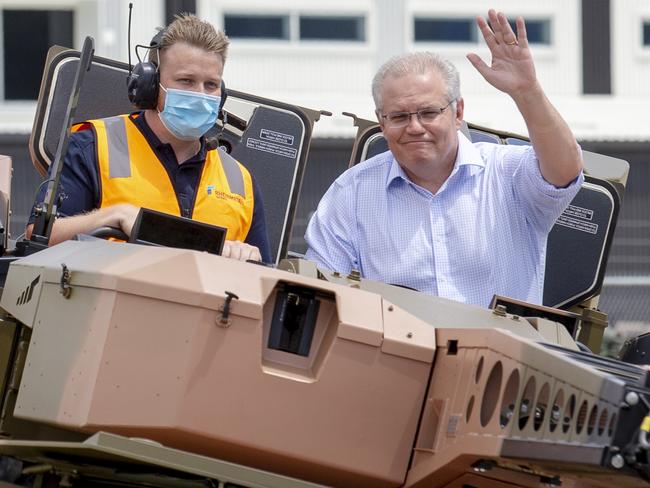 Brisbane, AUSTRALIA - NewsWire Photos October 11, 2020: Prime Minister Scott Morrison rides in a new Australian Boxer CRV at the official opening of the Rheinmetall Military Vehicle Centre of Excellence. The defence technology company in Redbank will create more jobs for Queensland. Picture: NCA NewsWire / Sarah Marshall