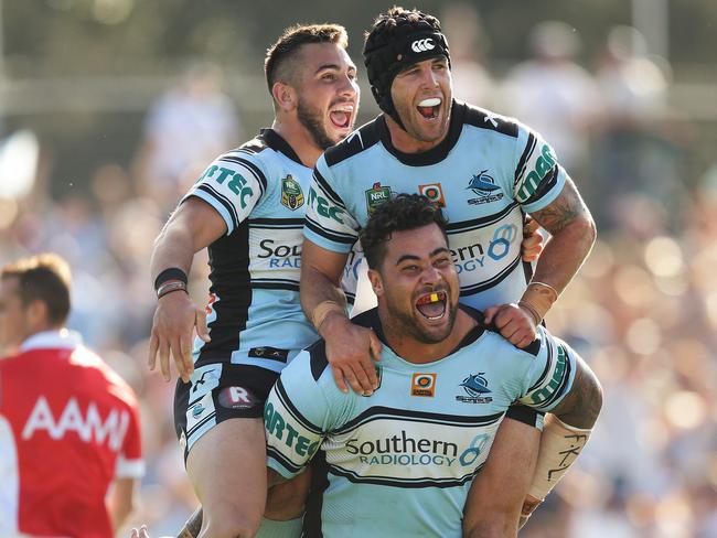 Cronulla's Jack Bird and Michael Ennis celebrate a try by Cronulla's Andrew Fifita. Pic Brett Costello