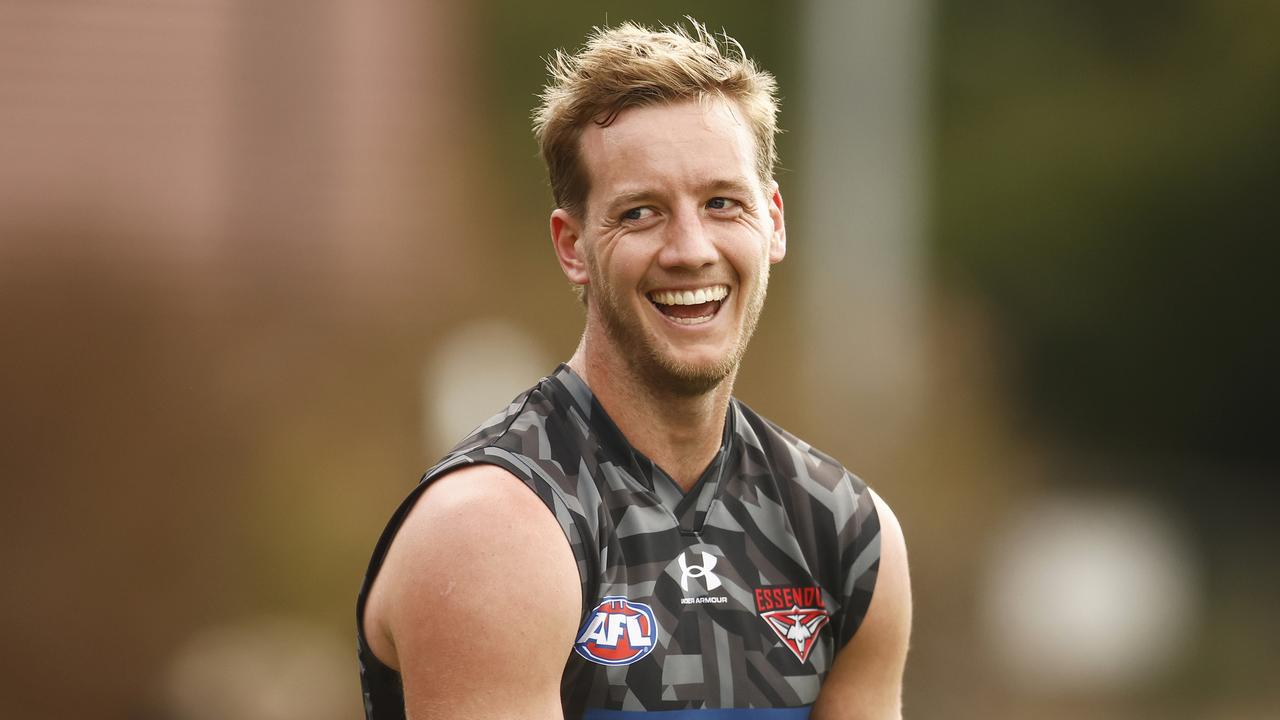 MELBOURNE, AUSTRALIA - JUNE 17: Darcy Parish of the Bombers laughs during an Essendon Bombers AFLW &amp; AFL training session at The Hangar on June 17, 2023 in Melbourne, Australia. (Photo by Daniel Pockett/AFL Photos/via Getty Images)