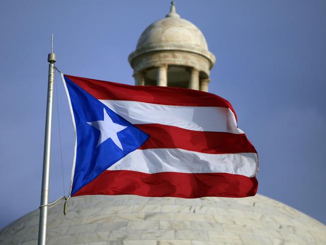 The small indebted territory of Puerto Rico has out-size influence on the nomination race, with a primary held on March 6. Picture: AP Photo/Ricardo Arduengo