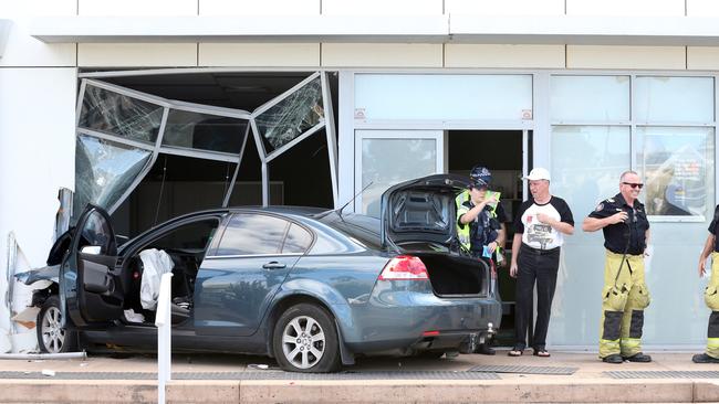 The scene of a single vehicle crash where a driver lost control and smashed into the Aussie Homeloans office. Picture: Richard Gosling