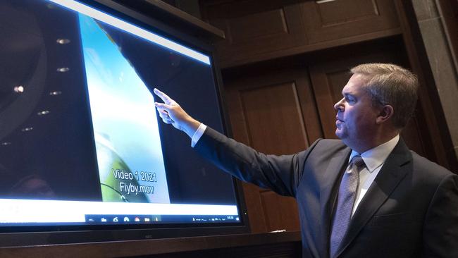 USDeputy Director of Naval Intelligence Scott Bray explains a video of an unidentified aerial phenomena, as he testifies before a House Intelligence Committee subcommittee hearing. Picture: Getty Images/AFP.