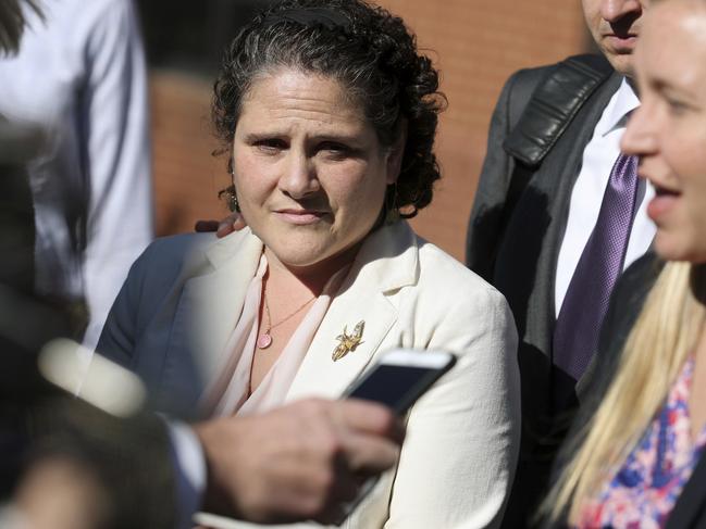 Nicole Eramo, left, listens to attorney Libby Locke, right, speak with the media outside the federal courthouse in Charlottesville, Va., on Friday, Nov. 4, 2016. A federal jury on Friday found Rolling Stone magazine, its publisher and a reporter defamed Eramo in a discredited story about gang rape at a fraternity house of the university. (Ryan M. Kelly /The Daily Progress via AP)