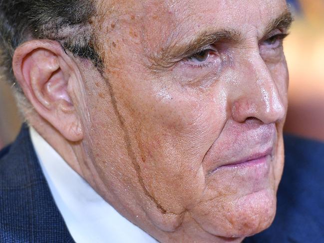 Sweaty work for Mr Trumps personal lawyer Rudy Giuliani. Picture: AFP