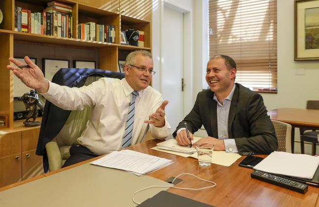 Prime Minister Scott Morrison and Treasurer Josh Frydenberg watch a Sharks game on TV at Parliament House. Picture: Sean Davey