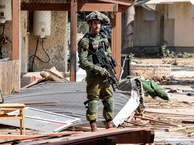 An Israeli army soldier looks on during a patrol in kibbutz Kfar Aza in southern Israel on October 18. Picture: AFP