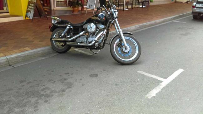 Lance Wensley's motorbike was parked here, at the middle ends of two car parks, when he was fined for parking in tow car spaces in Mary St. Picture: Contributed