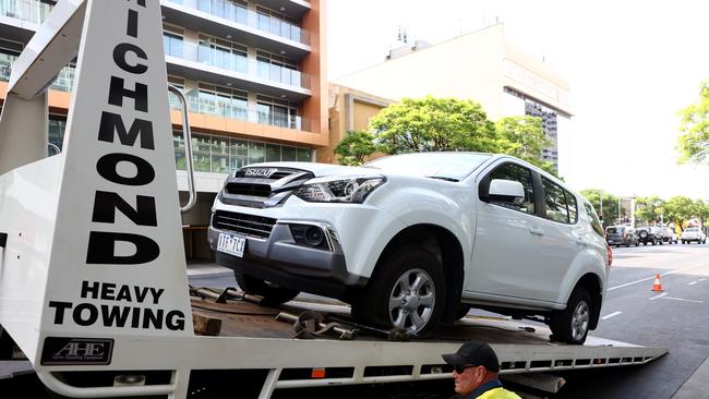 A tow truck takes one of the cars from Morphett street. Picture: Kelly Barnes