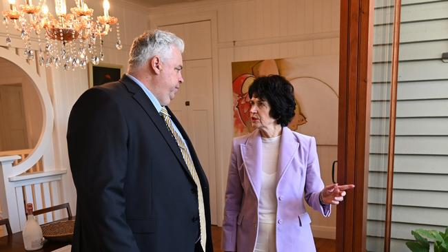 Real estate agent Judi O’Dea (right) talks to auctioneer Mark MacCabe before an auction of a house in Bardon. Picture: Dan Peled