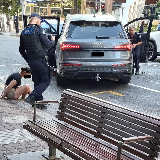 Police drag the occupants from the suspected stolen Audi.