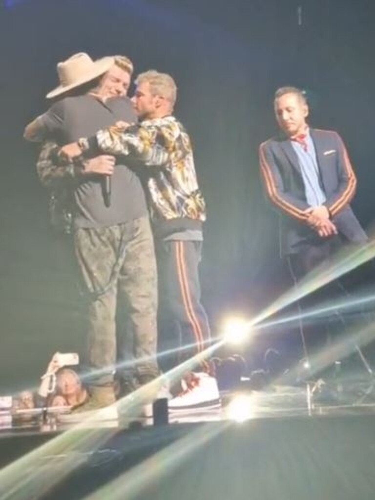 The whole band hugged Nick who could barely speak. Picture: Twitter/All That Dazzles