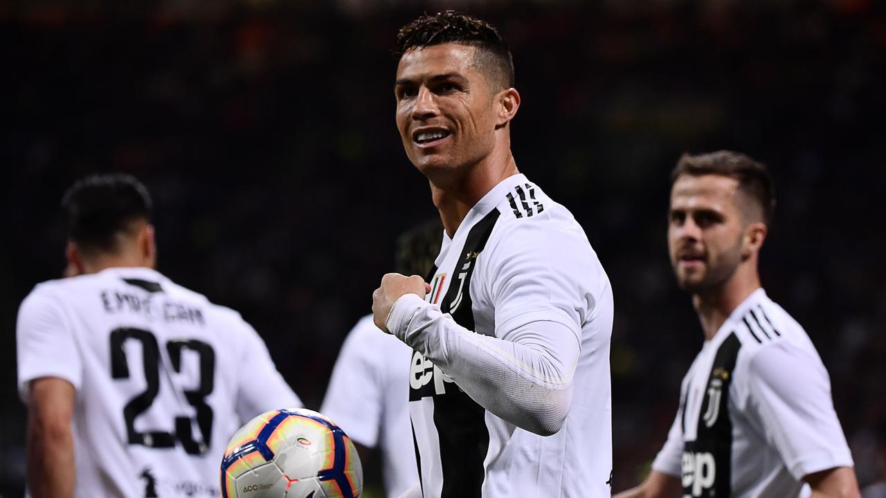 Juventus' Portuguese forward Cristiano Ronaldo (C) celebrates after scoring a goal