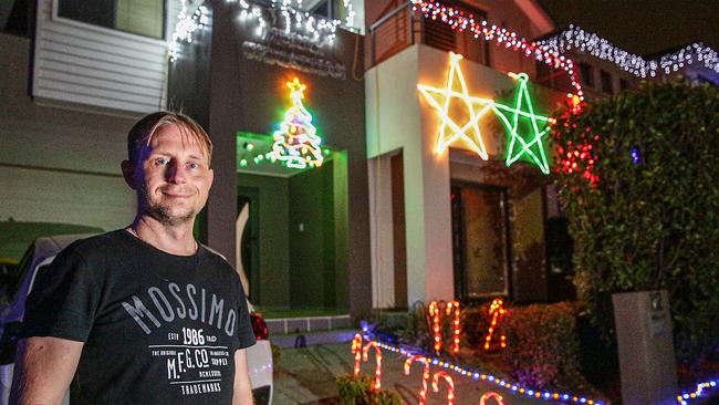 Michael Gotfredsen in front of his iridescent display. Picture: Carmela Roche