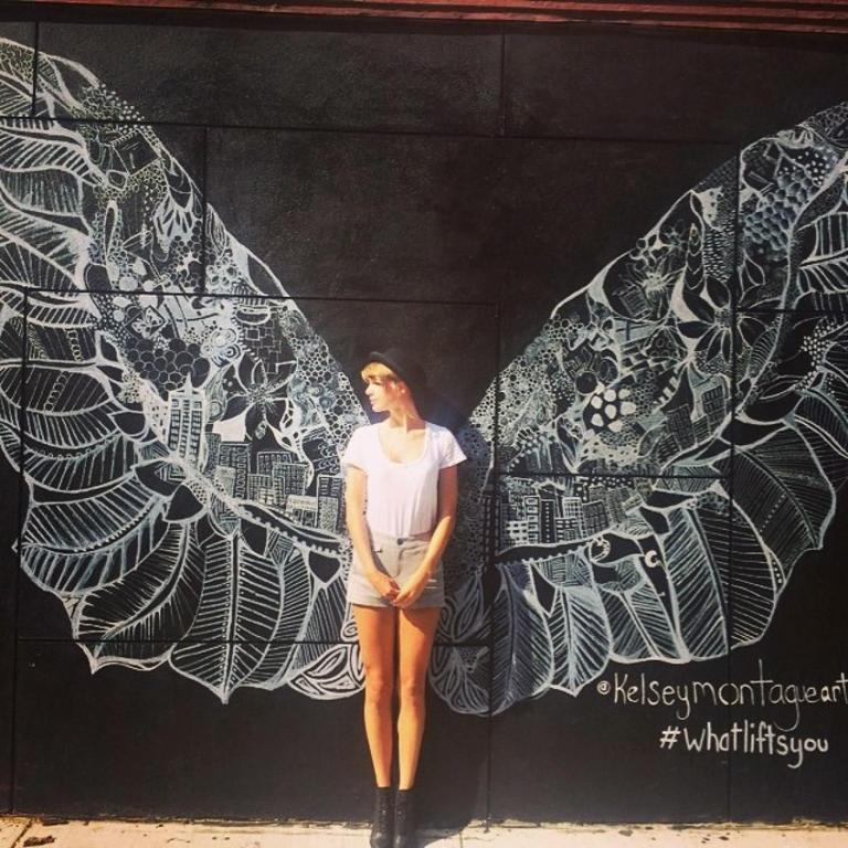 Interactive street artist Kelsey Montague’s winged murals have proven popular on Instagram following endorsements from celebrities like Taylor Swift. Picture: Taylor Swift/Instagram