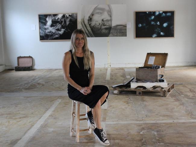 Mackay creative photographer Leah McLean amid her exhibition, titled Deep Calm. Picture: ANDREW KACIMAIWAI