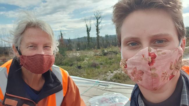 Bega Valley Extinction Rebellion members Sally-Anne Brown and Annabell Gottwald blockade the road to the Eden chip mill. Picture: XR