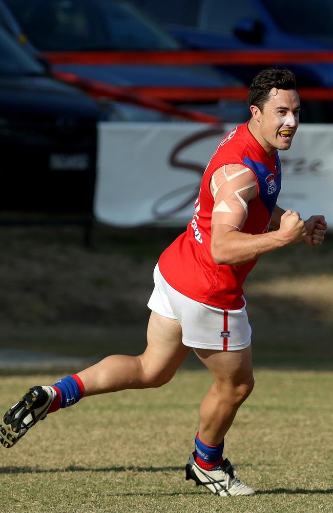 Lachlan Harris of the Colts celebrates a goal.