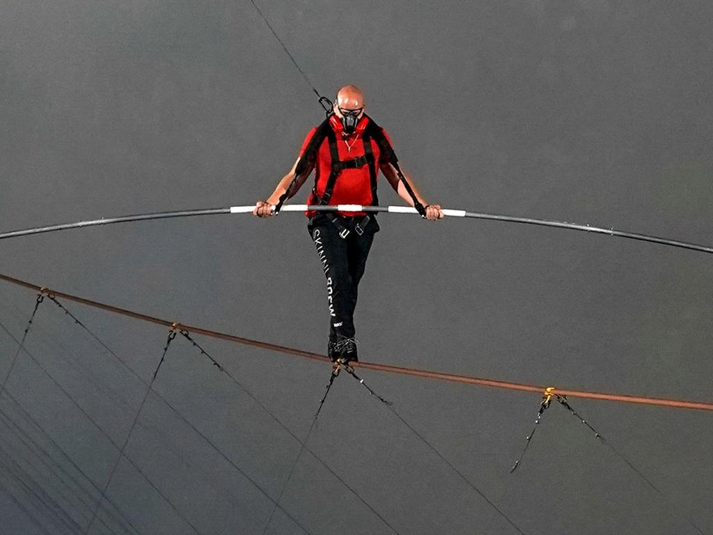 Handout picture released on March 5, 2020 by American Broadcasting Companies (ABC) showing US acrobat Nik Wallenda as he crosses the 1,800 foot high wire walk over the Masaya Volcano in Nicaragua, on March 4, 2020. - Wallenda became the first person to complete the full crossing. (Photo by Jeff Daly / American Broadcasting Companies / AFP) / TABLOIDS OUT; NO BOOK PUBLISHING WITHOUT PRIOR APPROVAL. NO ARCHIVE. NO RESALE. RESTRICTED TO EDITORIAL USE - MANDATORY CREDIT "AFP PHOTO /ABC-JEFF DALY" - NO MARKETING - NO ADVERTISING CAMPAIGNS - DISTRIBUTED AS A SERVICE TO CLIENTS