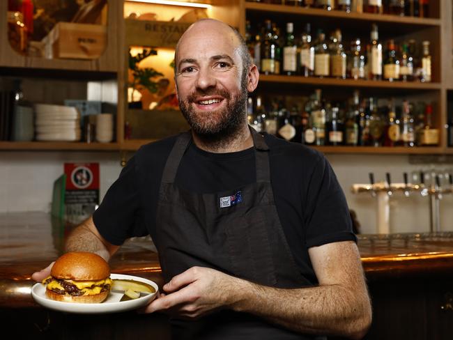 DAILY TELEGRAPH SEPTEMBER 18, 2024, HOLD FOR KC.Executive chef Pip Pratt with the Gidley Burger at The Rover in Surry Hills which has been named as Australia's best burger. Picture: Jonathan Ng