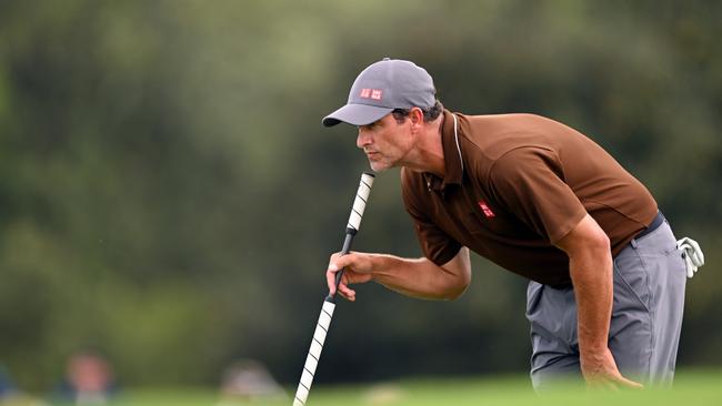 Adam Scott lines up a put on day one of the Masters. Picture: Ross Kinnaird/Getty Images