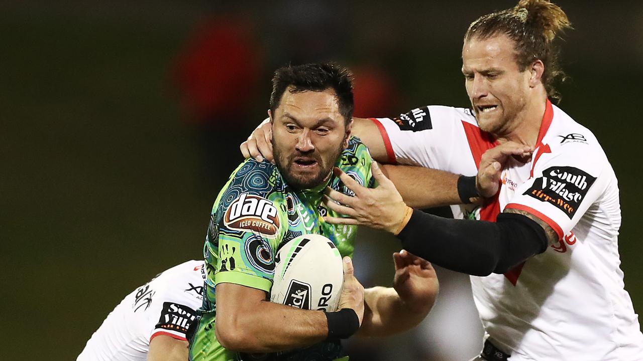 Jordan Rapana of the Raiders takes on the Dragons in Round 17
