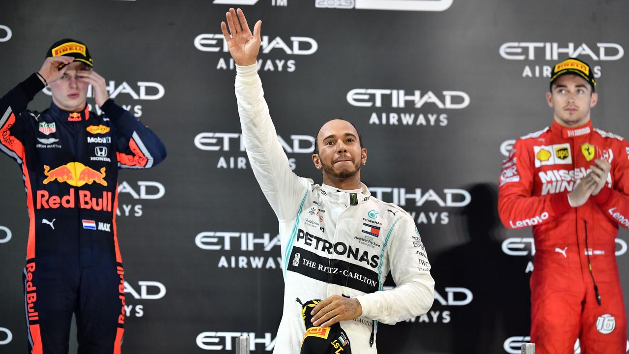 Hamilton on the podium with Verstappen and Leclerc.