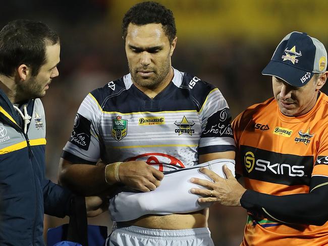 Justin O'Neill is helped from the field after injurying his elbow against Penrith.