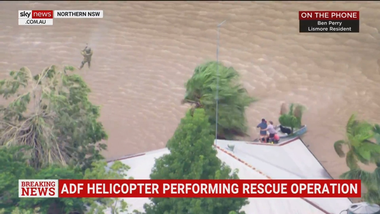 WATCH: ADF chopper rescues family stranded on roof