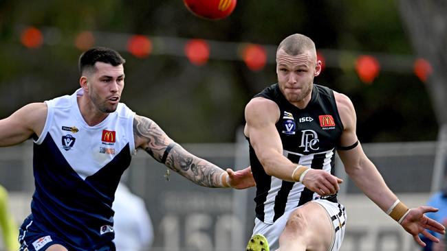 Melton South’s Darby Schilder tries to stop Darley’s Brett Bewley during a match earlier this year. With Melton South out the league is now down to 10 teams. Picture: Andy Brownbill