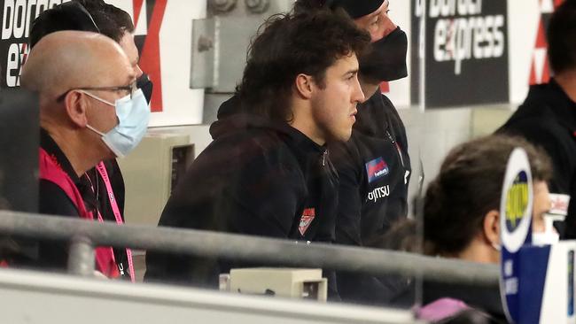 Injured star Andrew McGrath looks a forlorn figure on the Essendon bench on Saturday night. Picture: AFL Photos/Getty Images