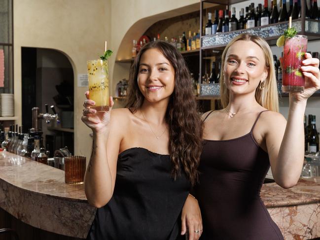 WEEKEND PAPERS ONLY -  Montana-Rose Lamb 25 with a Passionfruit Limonata, and Darcy Moore 26 with a Blueberry Nojito, enjoying Mocktails at Sasso Italiano in Woollongabba. Picture Lachie Millard