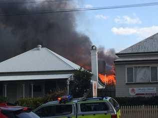 Firefighters are battling a house fire on Herries St, East Toowoomba.