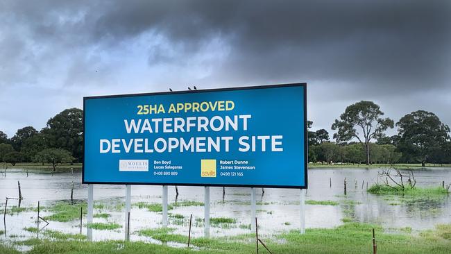 A proposed new housing estate at Carrara on the Robina Parkway is flooded after heavy torrential rain fell on the city overnight causing localised flash flooding. NCA NewsWire / Scott Powick.