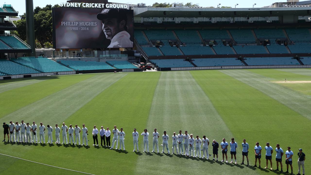 Umpires, players and staff gathered on the SCG to pay tribute to Phillip Hughes on the 10th anniversary of his death before play began on the final day of the Sheffield Shield clash between NSW and Tasmania. Picture: Jason McCawley / Getty Images