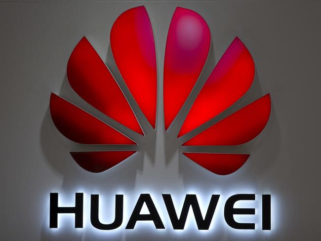 FILE - In this Wednesday, July 4, 2018, photo, the Huawei logo is seen at a Huawei store at a shopping mall in Beijing. Chinese-owned telecommunications giant Huawei has been blocked from rolling out Australia's 5G network due to security concerns. (AP Photo/Mark Schiefelbein, File)