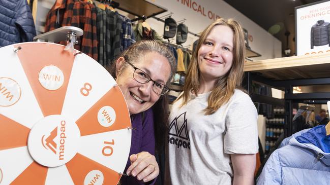 Spinning to win an opening day prize after making a purchase is Tamara Counter (left) with Macpac staff member Zoey Twidle as the shop opens in Grand Central, Saturday, May 25, 2024. Picture: Kevin Farmer