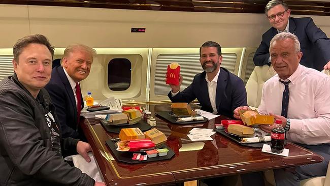 Donald Trump, his son Donald Jr, RFK Jr and Elon Musk with their McDonald’s meal on their way to the UFC fight Credit: Margo Martin