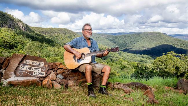 Singer-songwriter John Williamson at his Springbrook property in the Gold Coast hinterland. Picture: Luke Marsden