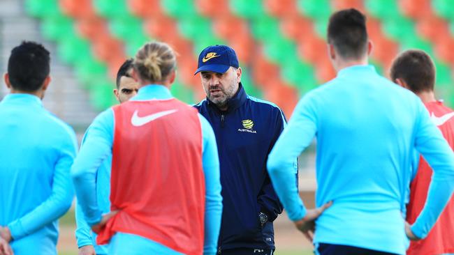 Ange Postecoglou makes a point to his players in preparation for the clash with Iraq. Picture: Mark Evans