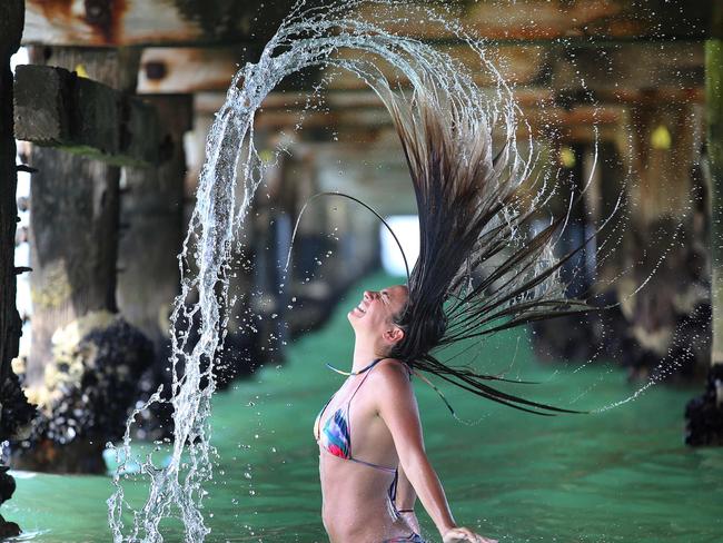 Under the pier at Albert Park proved a great place to stay cool. Picture: Alex Coppel