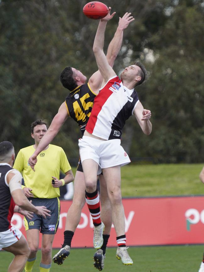 SFL: Troy Kelm wins the tap for St Kilda City. Picture: Valeriu Campan