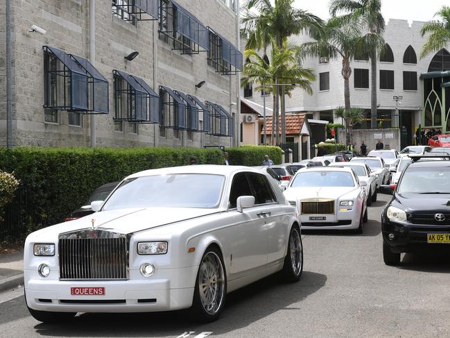 A procession of Rolls Royces and Bentleys leave the funeral. Picture: AAP