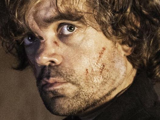 In this image released by HBO, Tyrion Lannister, portrayed by Peter Dinklage, appears in a scene from season four of "Game of Thrones." The season five premiere airs on Sunday. (AP Photo/HBO, Helen Sloan)