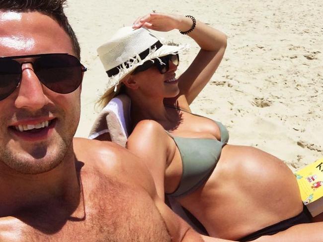 “Beach, Bump and Books,” Burgess wrote to social media. Picture: Instagram