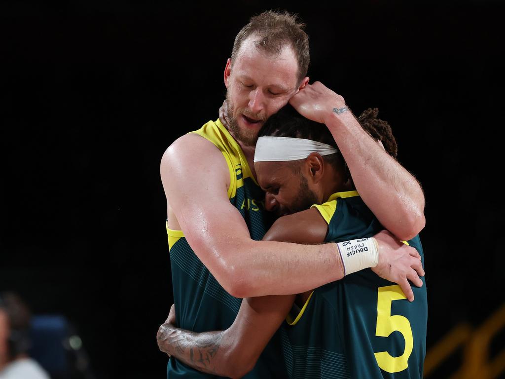 We did it. Joe Ingles and Patty Mills embrace after securing Australia bronze. (Photo by Kevin C. Cox/Getty Images)