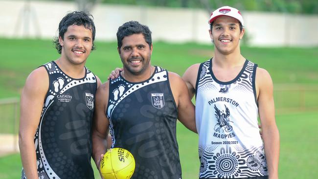 Alwyn Davey and his twin sons Alwyn Jr (R) and Jayden at Cazalys Oval ahead of the AFL national draft. Picture: Glenn Campbell