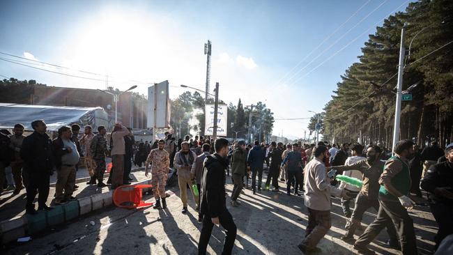 People disperse near the site where two explosions in quick succession struck a crowd marking the anniversary of the 2020 killing of Guards general Qasem Soleimani. Picture: AFP
