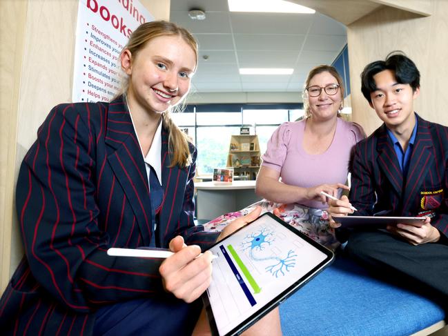 L to R, Indi Fletcher 17yrs in year 12, teacher Aliska Bierman, Harris Zhong 18yrs in year 12, how a schools trial will embrace AI in the curriculim, State High, South Brisbane, on Friday 6th October 2023 - Photo Steve Pohlner